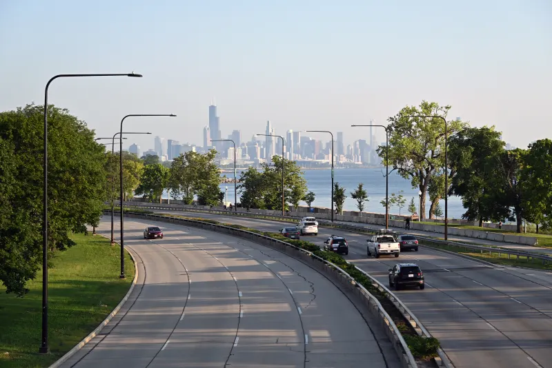 Lake Shore Drive curving along Lake Michigan toward the downtown Chicago skyline, Illinois